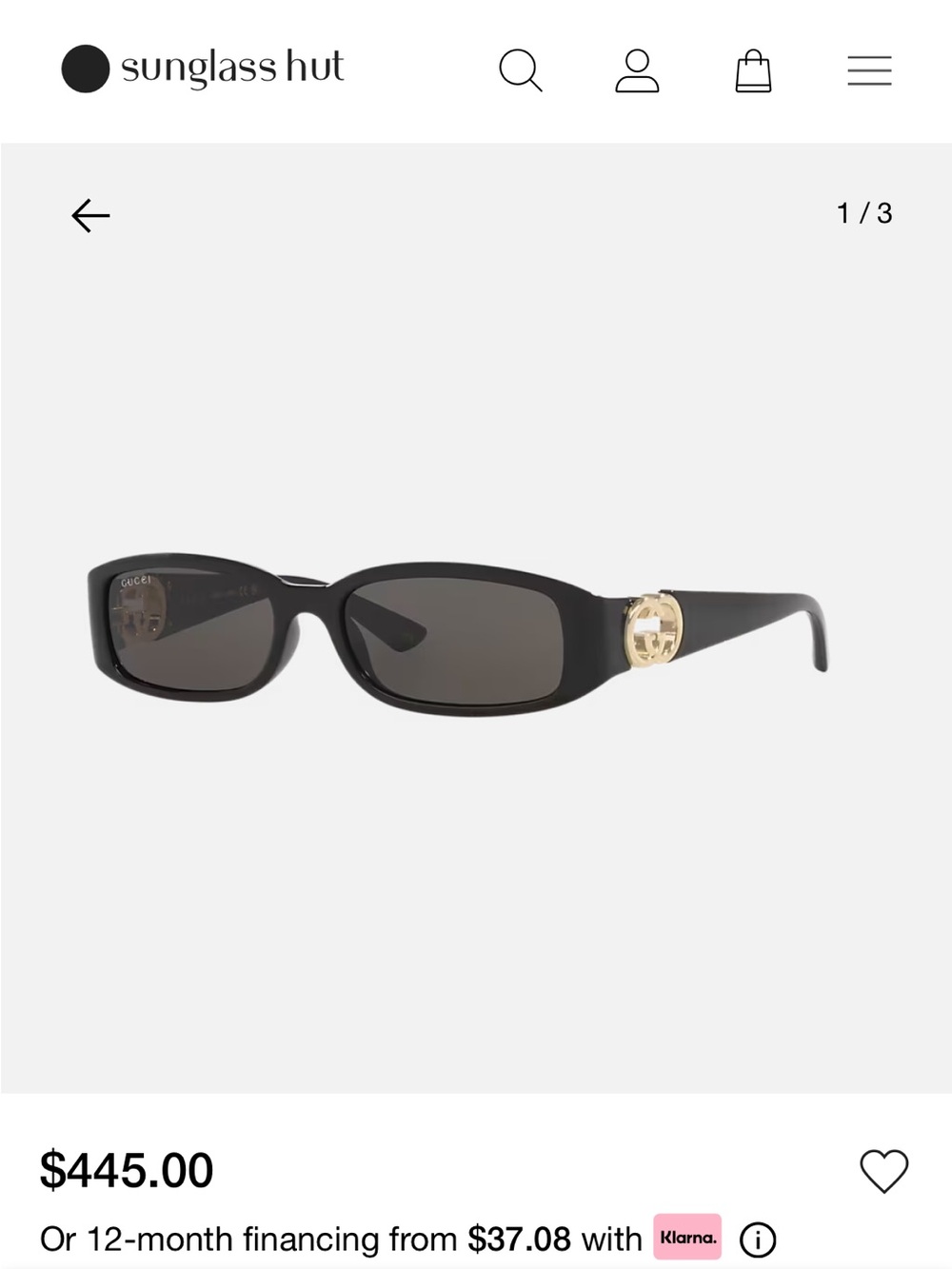 Gucci Black Oval Sunglasses with Gold Logo Accent